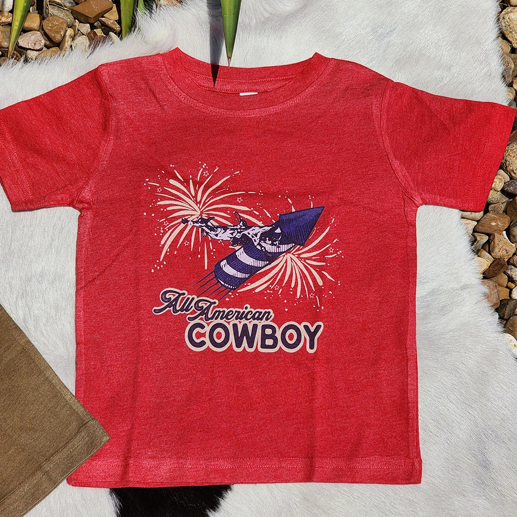 red tee with cowboy riding a rocket