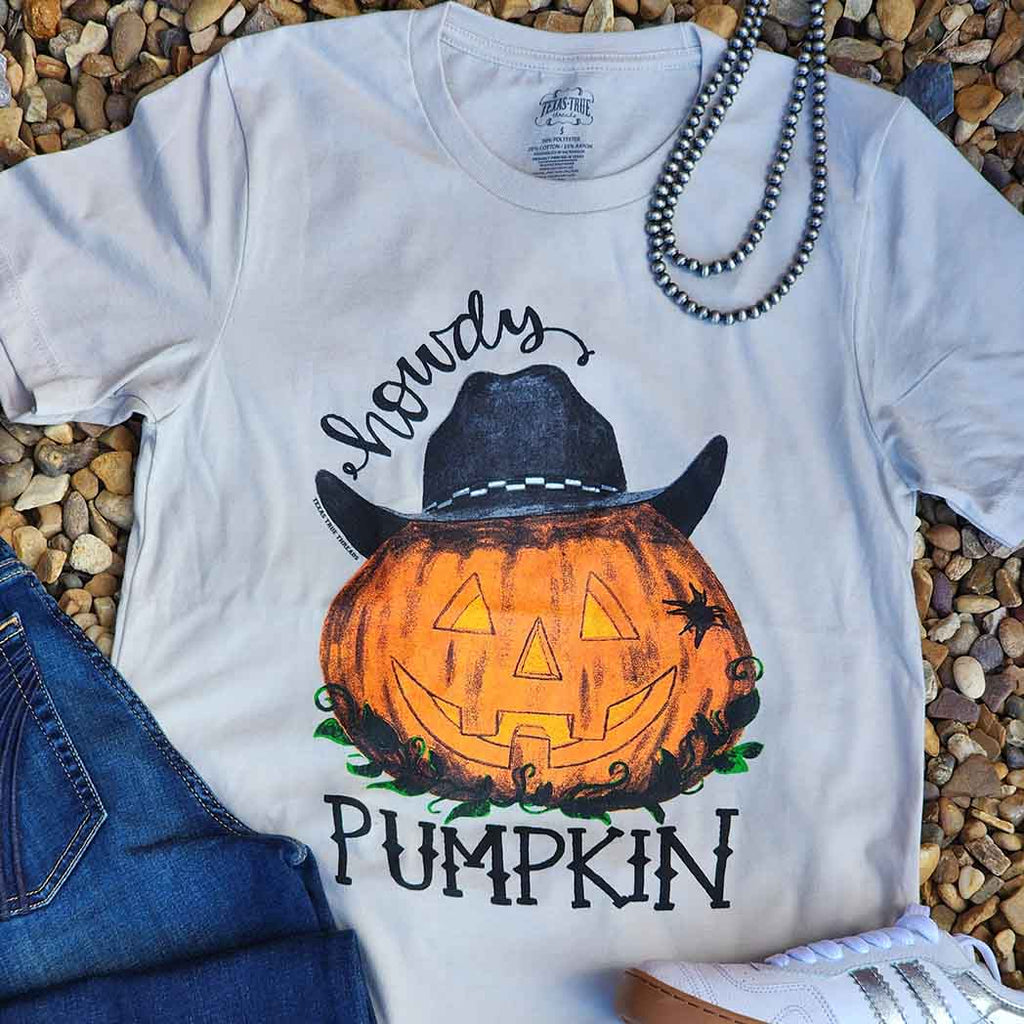 tan tee with pumpkin wearing a cowboy hat 