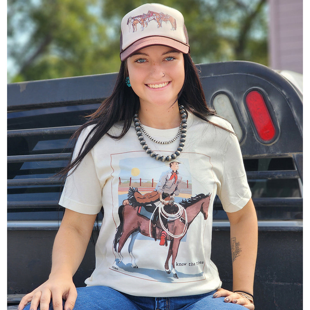 natural colored tee with horse and rider in the front of the tee. A very punchy looking tee