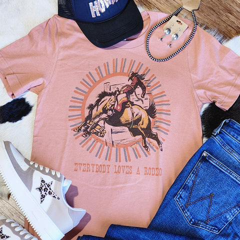 mauve colored tee with bronc rider on the front. Very punchy look 