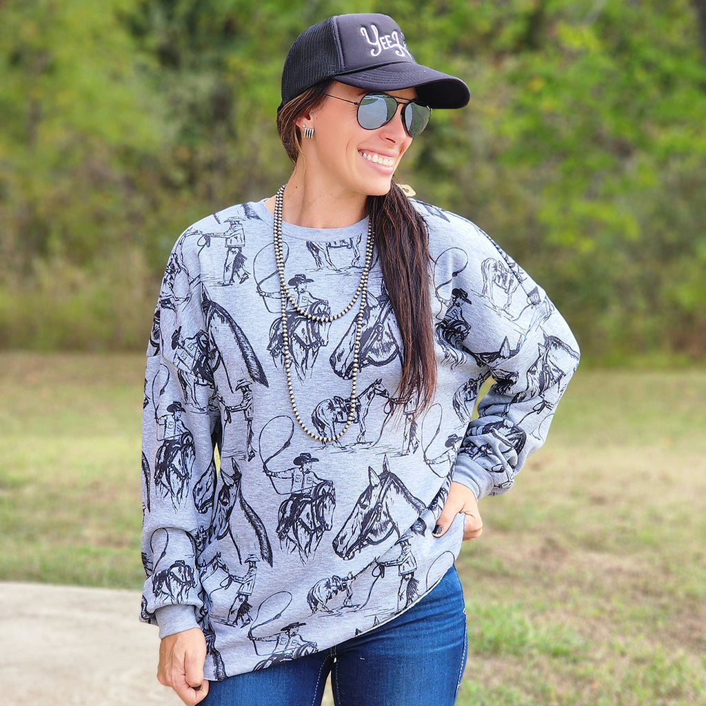 Grey natural hem sweatshirt with Horse and rider print all over the whole shirt . Soft and buttery feel 