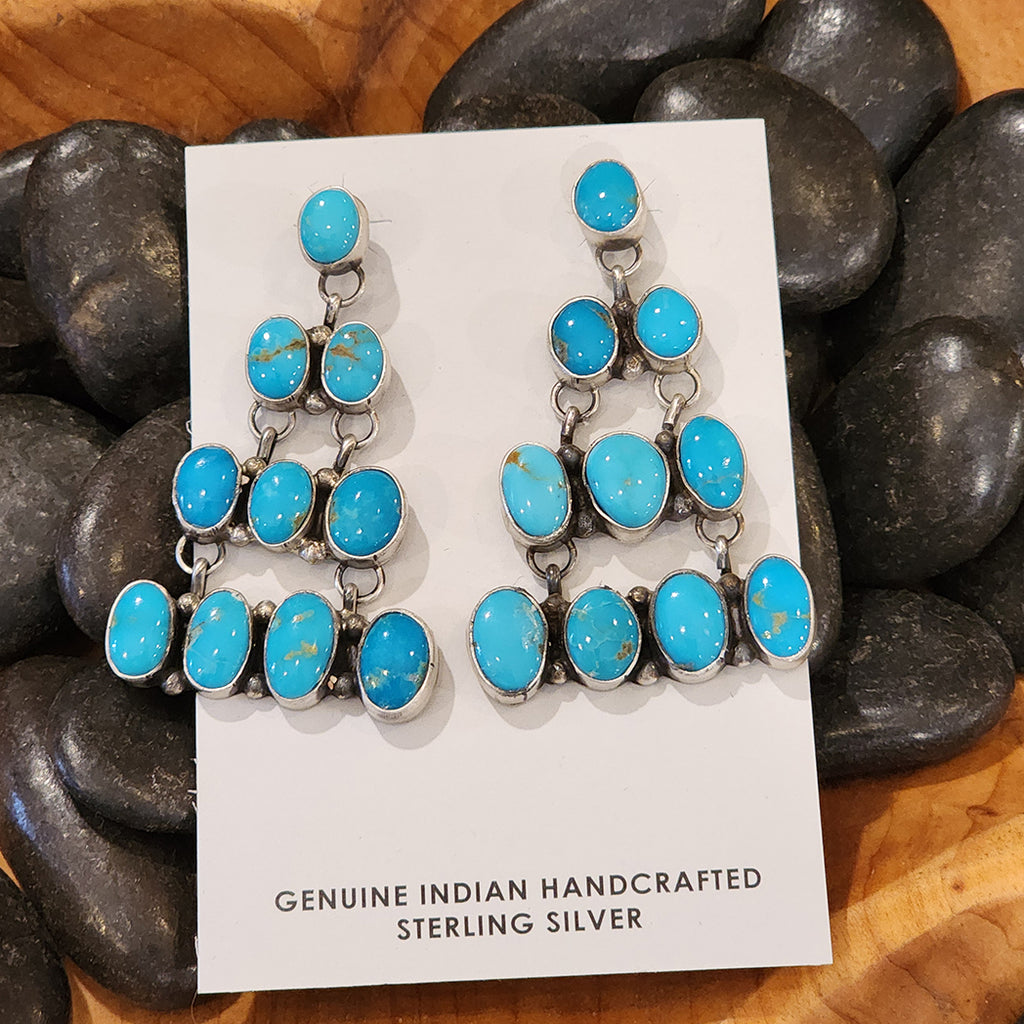 10 Blue Ridge turquoise stones set in a triangle shape to form a stunning pair of statement piece earrings 