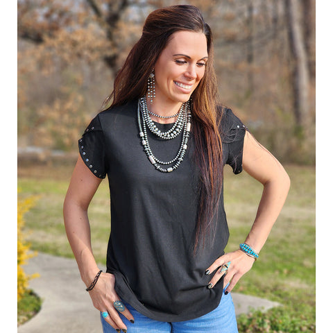 Black tee with concho studs on the sleeves 