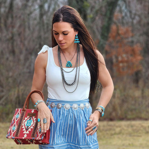 white body suit with tank sleeves and bows on the shoulder