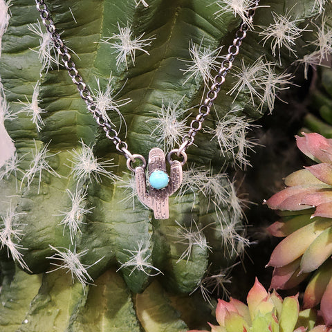 small cactus pendant with single turquoise stone on an 18 inch chain