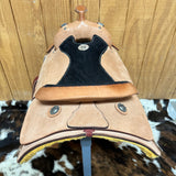 Rear view of the saddle showing the padded seat and the silver conchos