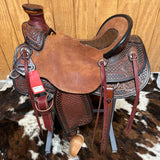 Left view of the saddle with the stunning antique finish mixed with reds