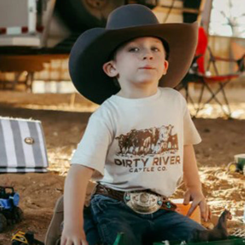 Natural Colored T-shirt with a Herd of Cows saying Dirty River Cattle Co.