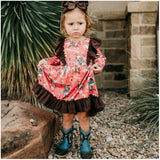 rust colored dress with horse print and brown ruffles 