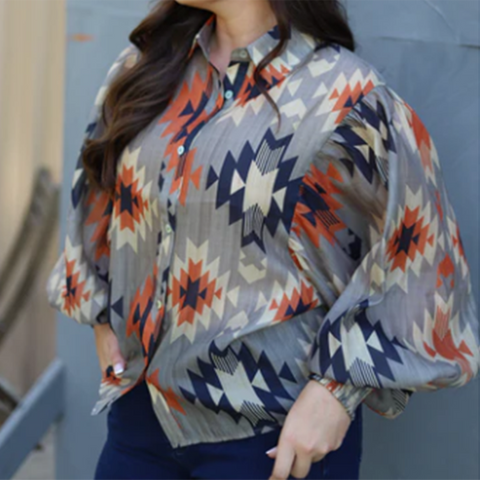 grey semi sheer blouse with rust, navy blue ans cream Aztec print. Blouse has Puff sleeves 