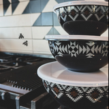 3 plastic bowels with lids for storage of food. Bowls are black with white and brown Aztec pattern 